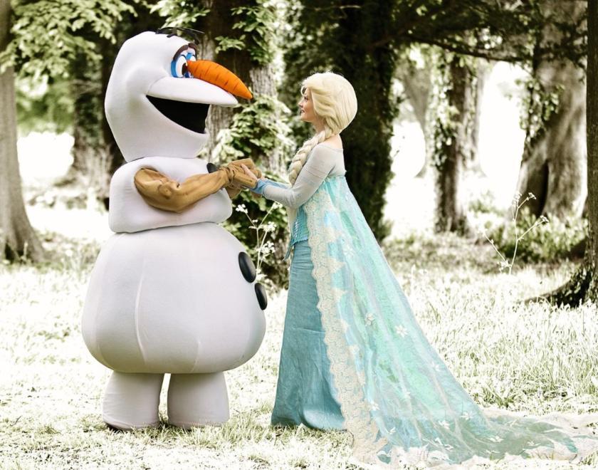 The images shows Olaf & Elsa in a wooded area.