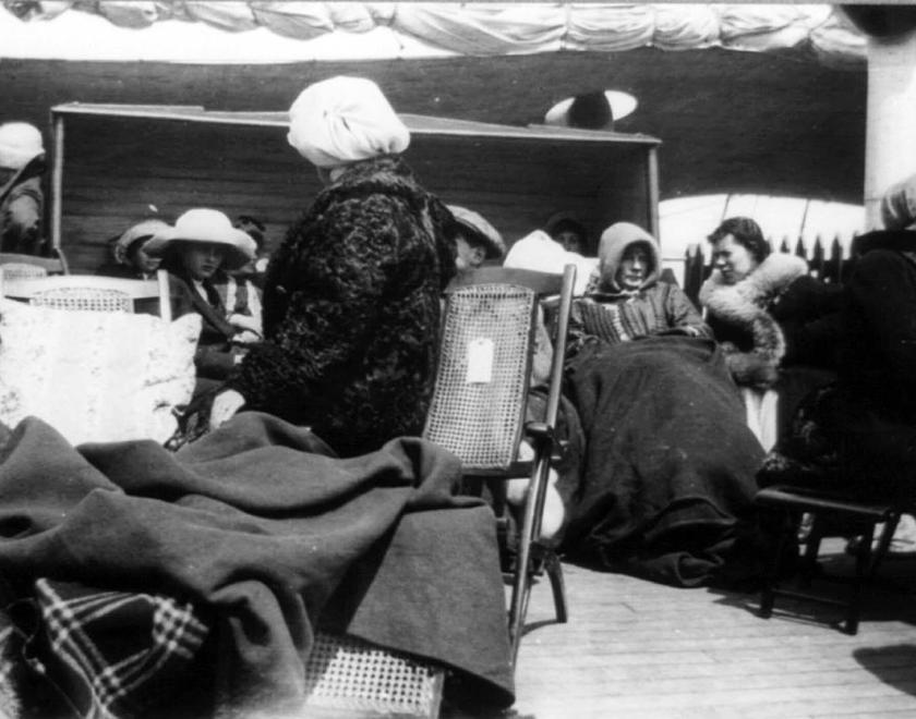 Survivors sitting on deck on the Carpathia after being rescued