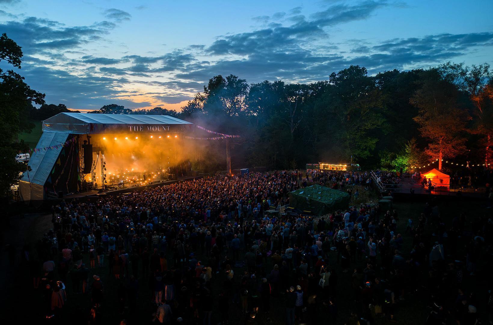 The stage and audience at Wasing Estate, taken at sunset