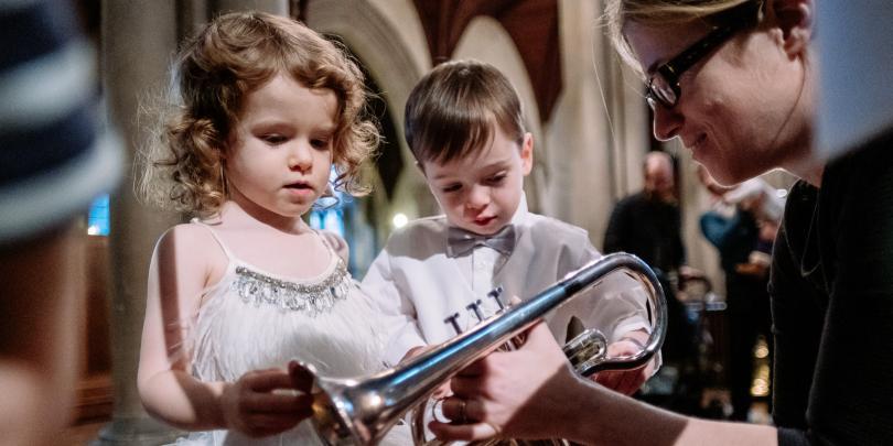 children inspecting trumpet at bach to baby concert