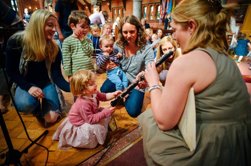 Musician performs for children