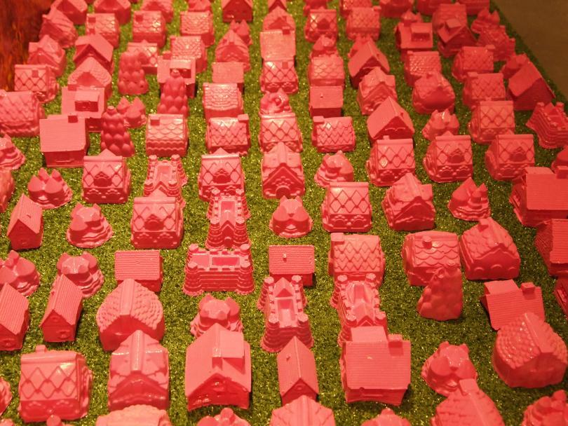 sculpture of small red houses 
