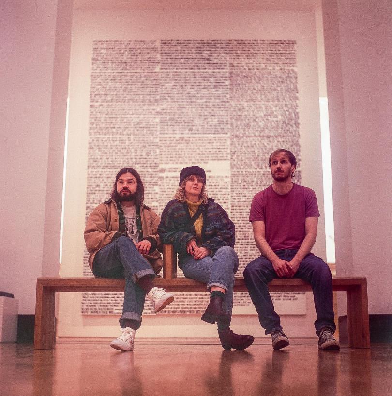 The Bug Club sitting on a bench