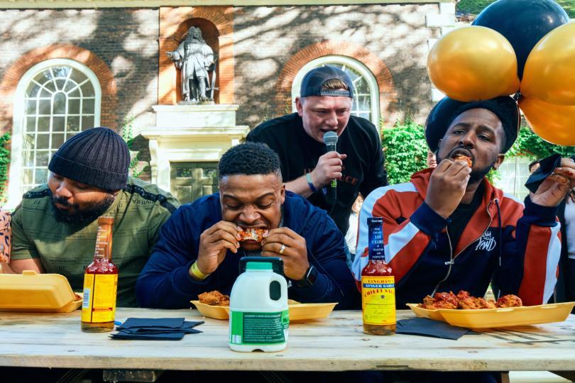 people eating chicken wings