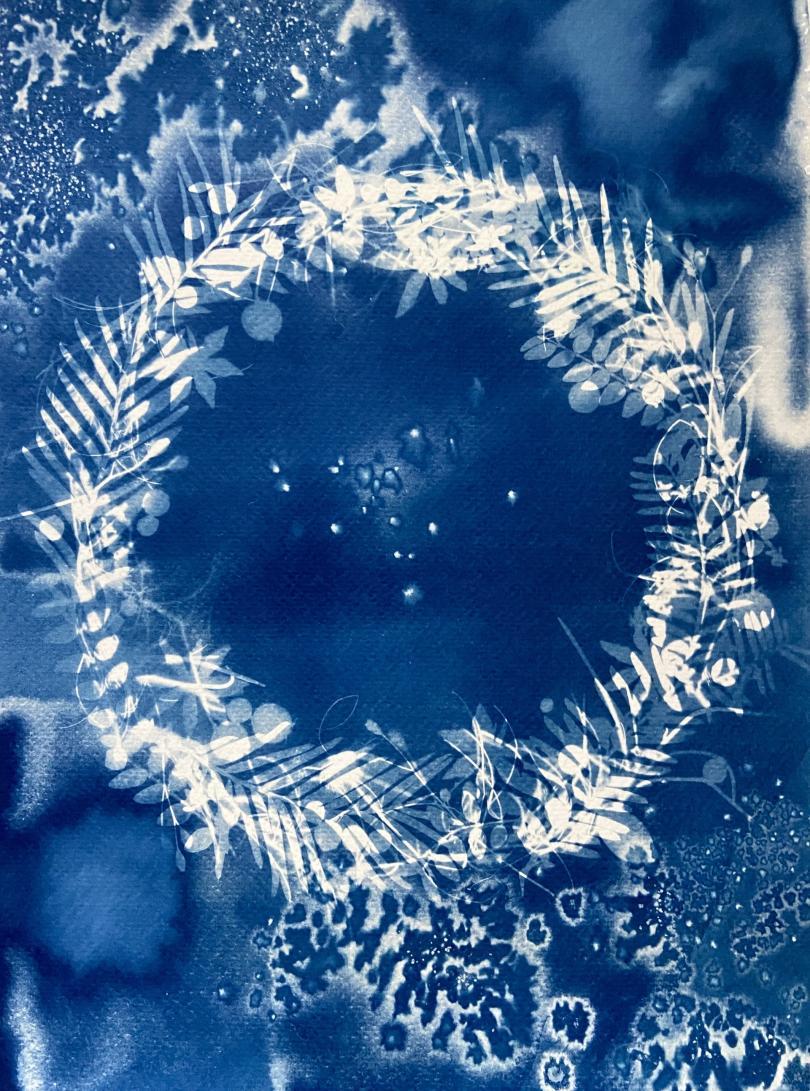 A cyanotype with a wreath design 