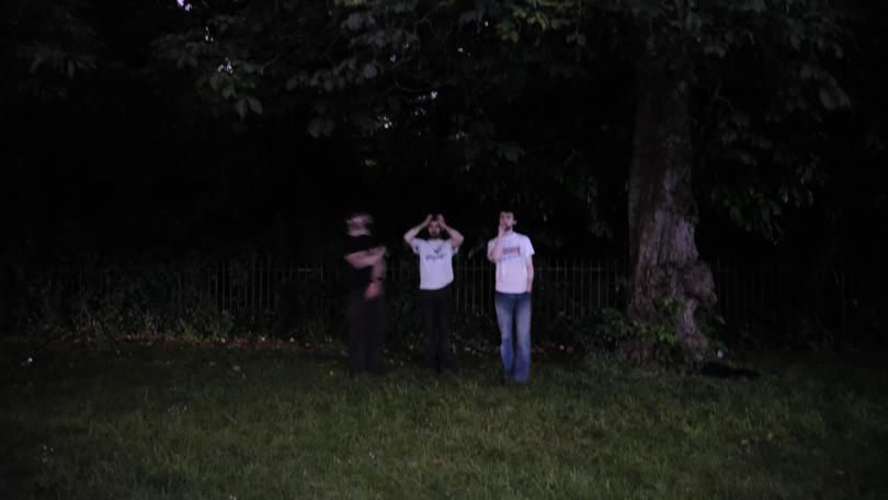 band image of them in a wood's in the dark