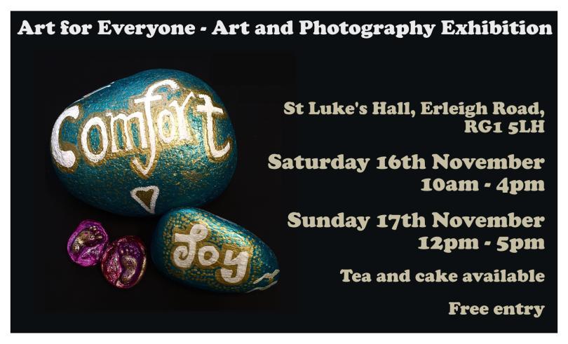 two pebbles painted with the words comfort and joy in green and gold, set against a black background