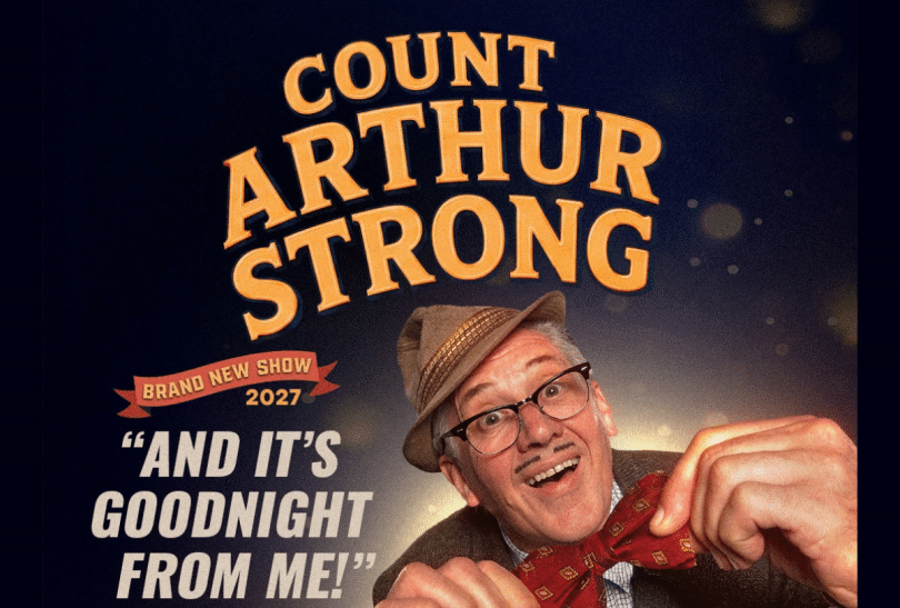 Count Arthur Strong wearing a hat and a bow tie