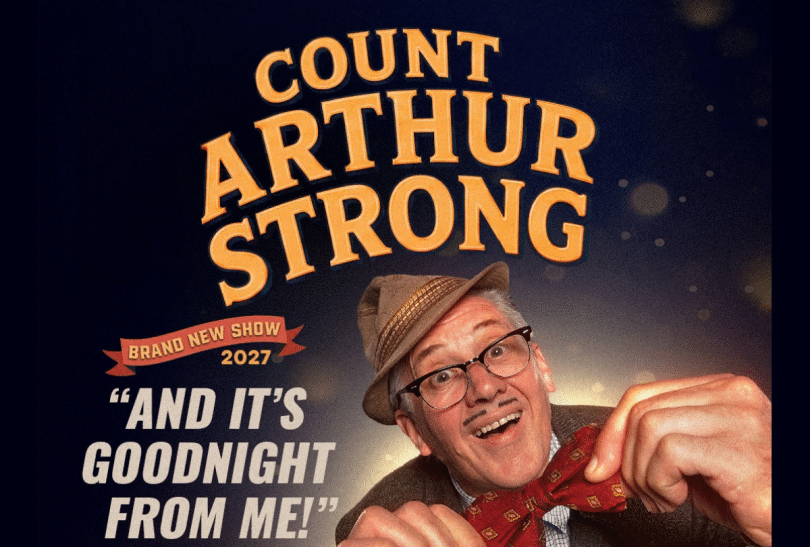 Count Arthur Strong wearing a hat and a bow tie