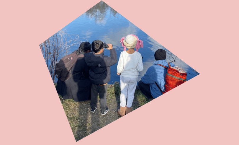 children looking over a pond