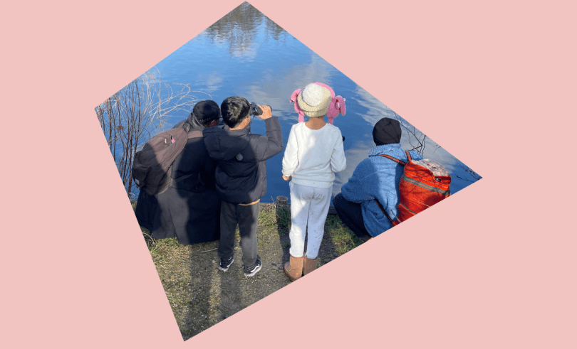 children looking over a pond