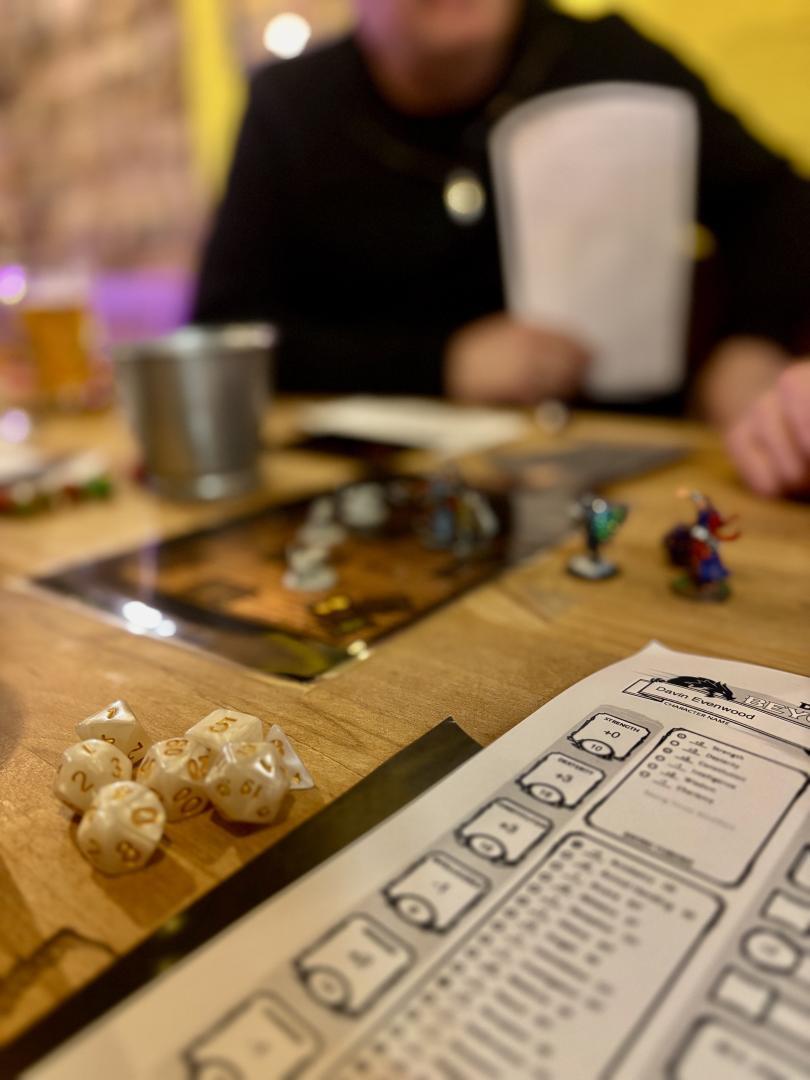 A DnD setup at the bar with people playing