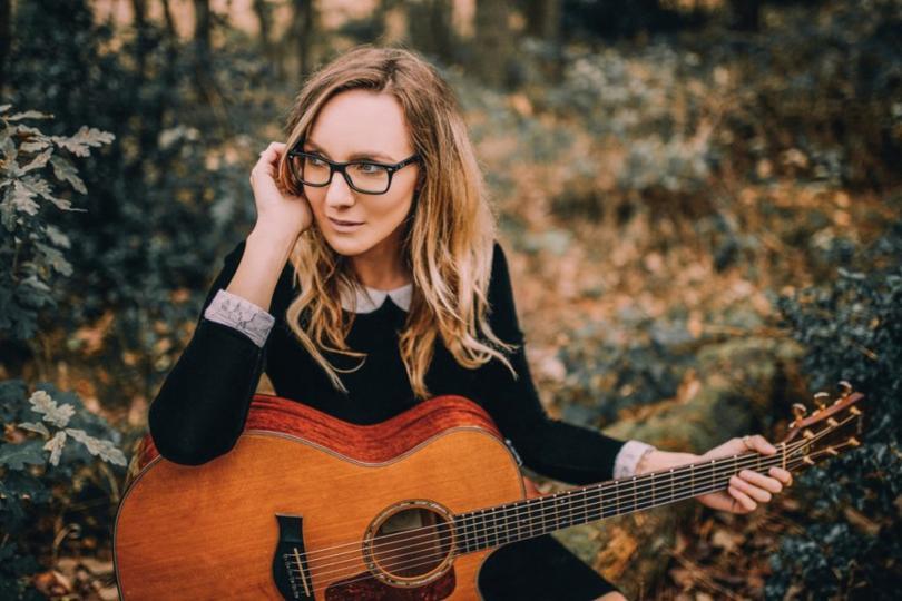 Emma Stevens with guitar