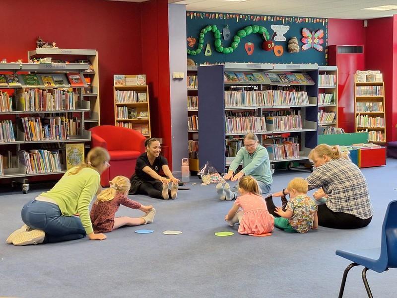 Families enjoying an introductory ballet session for under-fives in a library