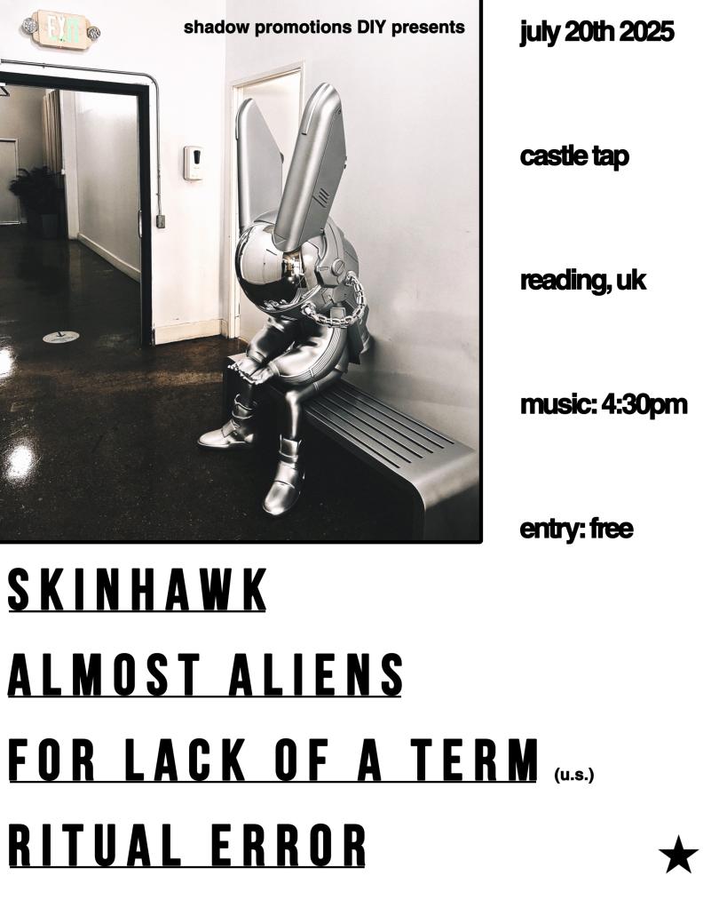 Black, silver and white poster. A silverish cyborg type creature sits leant forward on a metal bench in an industrial corridor