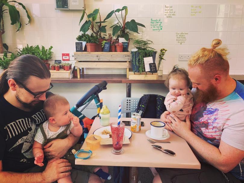 Dads and their babies eating, drinking and socialising at the cafe