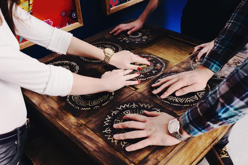 people playing a board game