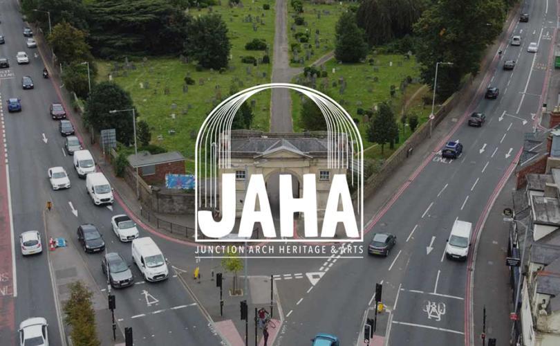JAHA logo over an aerial view of the Arch