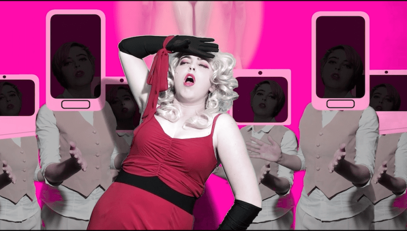 performance artist in red dress surrounded by bodies with mobile phones for heads