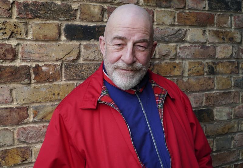 Jeff Innocent stood in front of brick wall