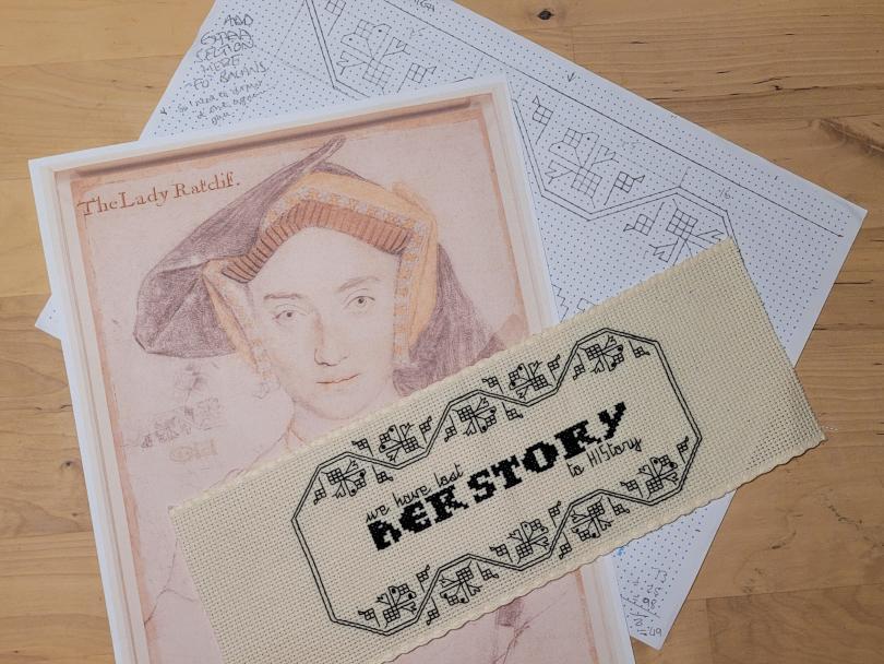 black embroidery and illustration of historical woman