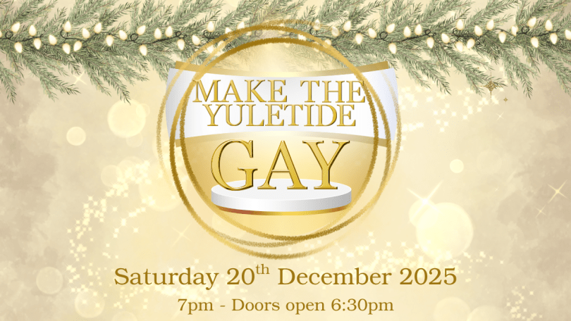 A gold bauble over a gold background with Christmas lights at the top