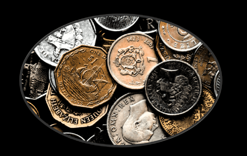 Image of a collection of old coins, including shillings and threepenny bits