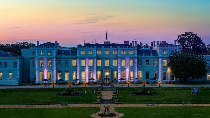 The image shows the Mansion House at dusk.