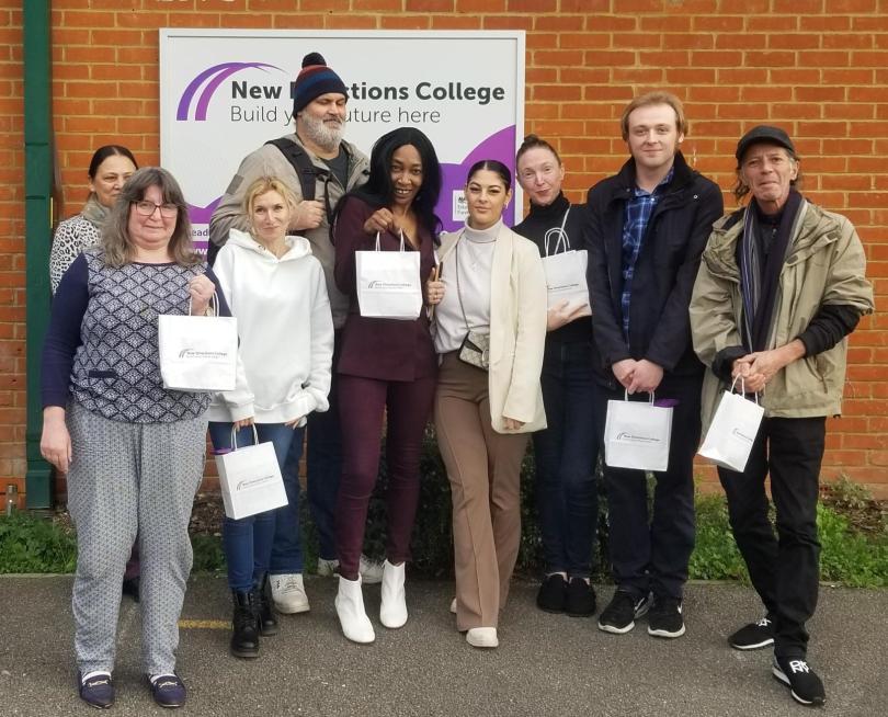 People standing in front of New Direction College