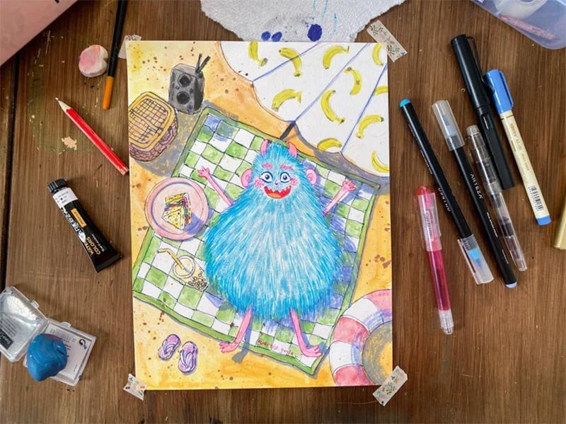 Mixed-media artwork of a blue fuzzy monster on the beach