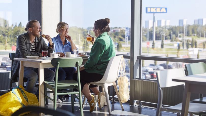 Group of people dining together in an IKEA store 