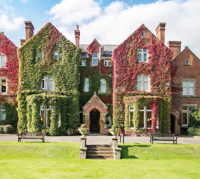 Image of the ivy clad front of Queen Anne's School