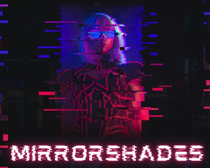 Poster for mega game "Mirrorshades" with the title in a cyberpunk-esque font and an illustration of a woman in mirrored sunglasses that appears to be "glitching" as if in cyberspace