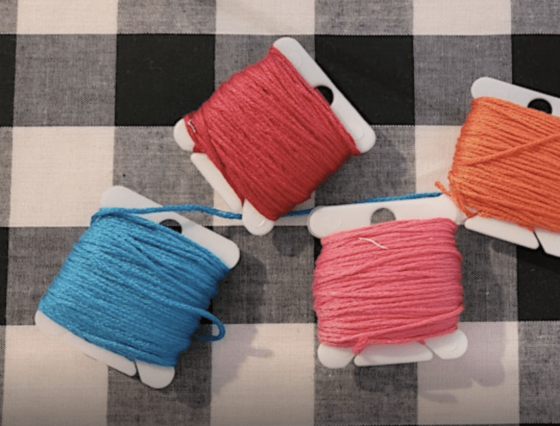 sewing threads on a checked back drop