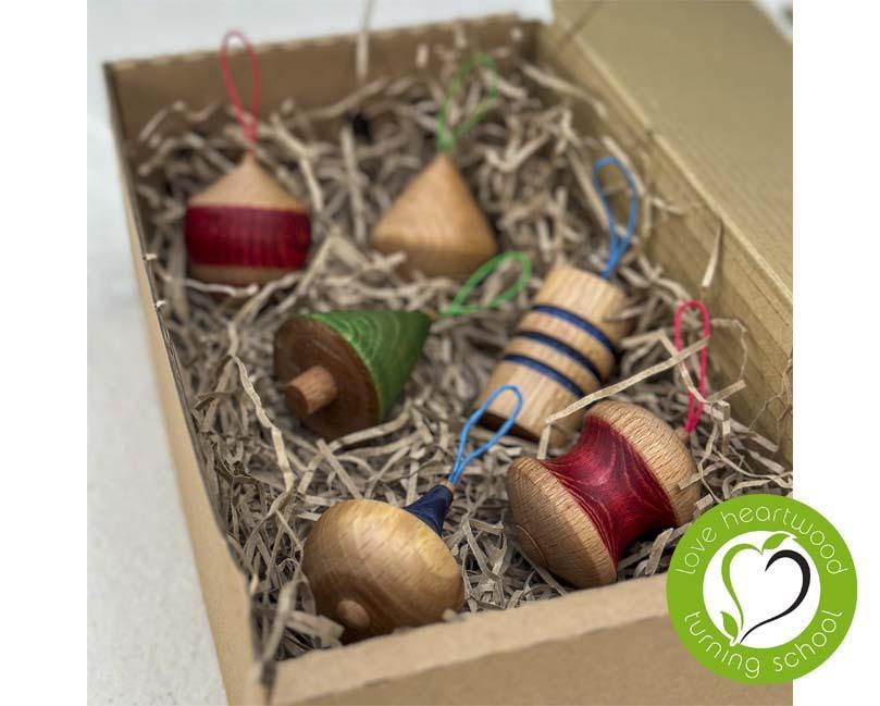 Set of six turned, wooden Christmas ornaments