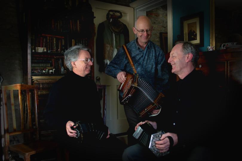 Photograph of the musicians, Three Pressed Men, with concertinas