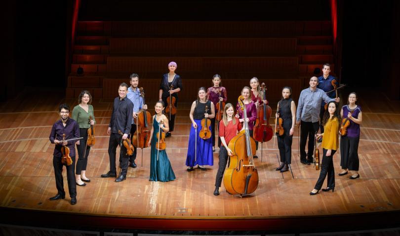 USE players standing on stage