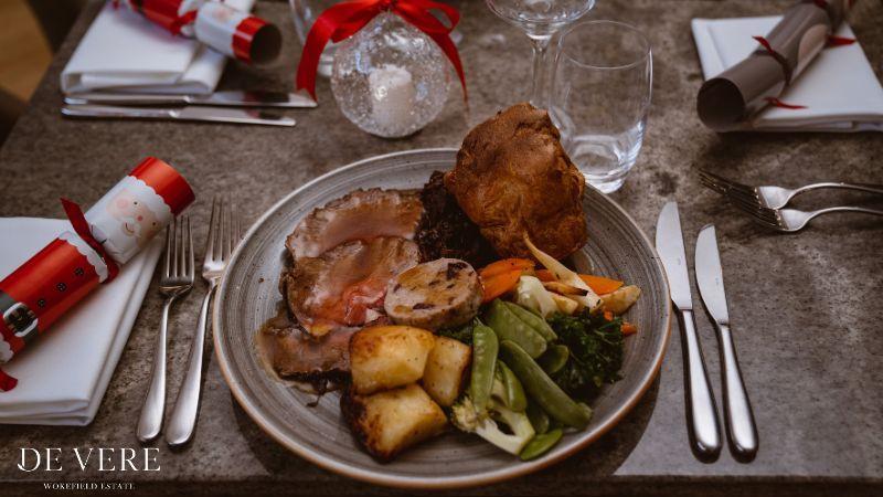The image is of a festive carvery lunch 