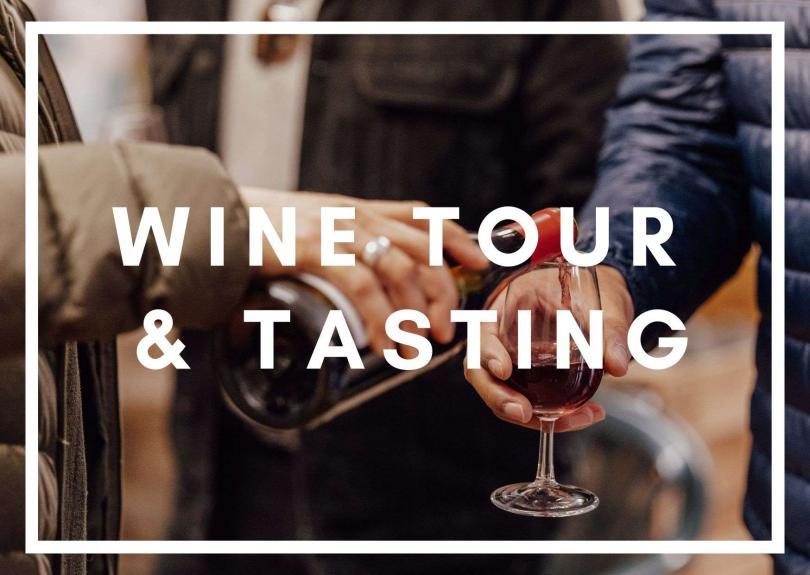 A close up image of a glass of wine being poured, with white text saying Wine Tour & Tasting