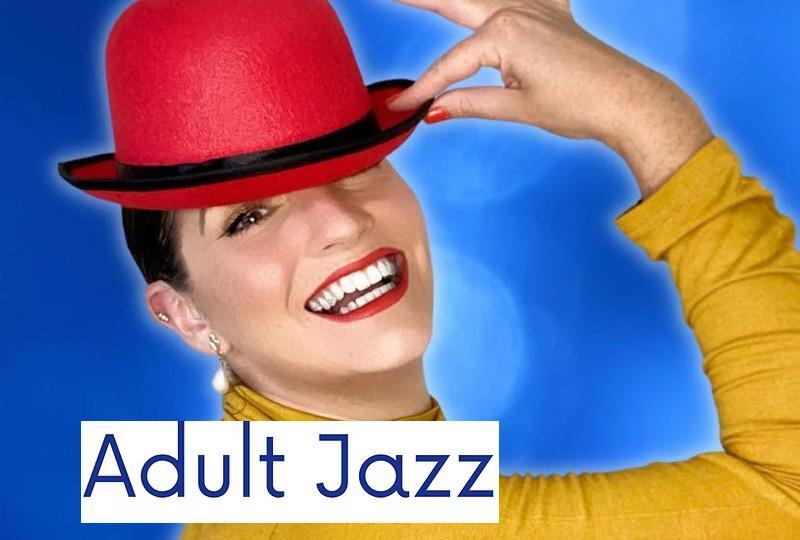 A woman posing with a red bowler hat