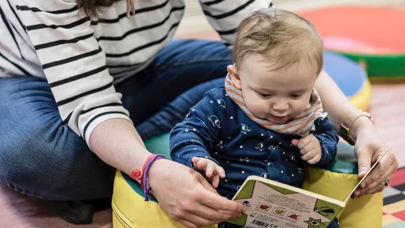 baby sitting on a beanbag