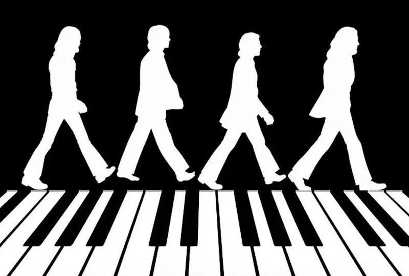 Silhouettes of the Beatles crossing Abbey Road except the zebra crossing is a piano keyboard