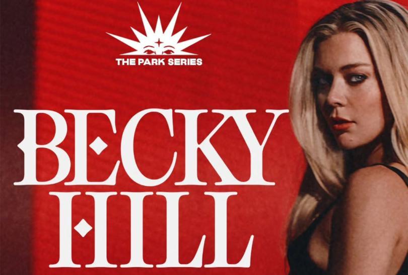 Photo of singer Becky Hill next to huge letters saying her name
