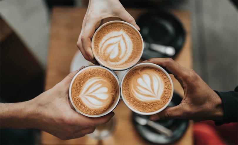 People holding hot drinks
