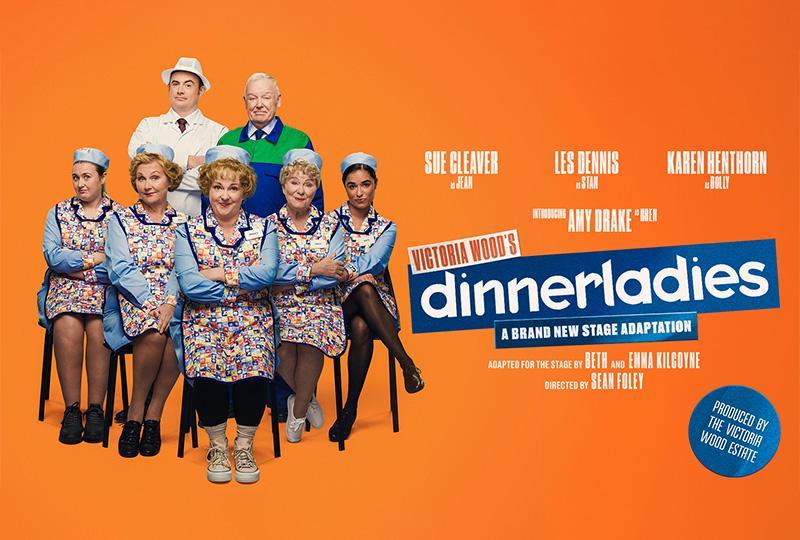 Banner artwork. The cast in costume gathered in a group, on an orange background with title text and cast names included.