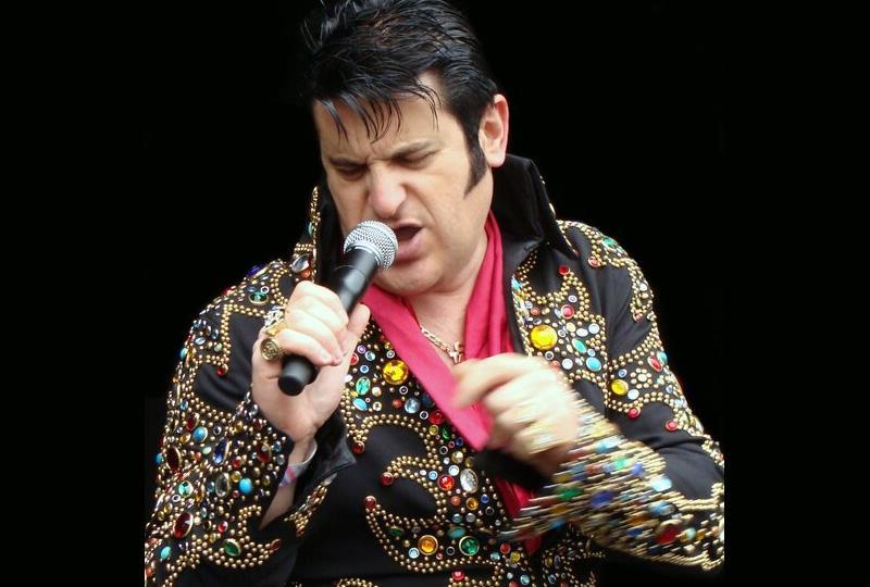 Man dressed as Elvis in a sparkly jumpsuit