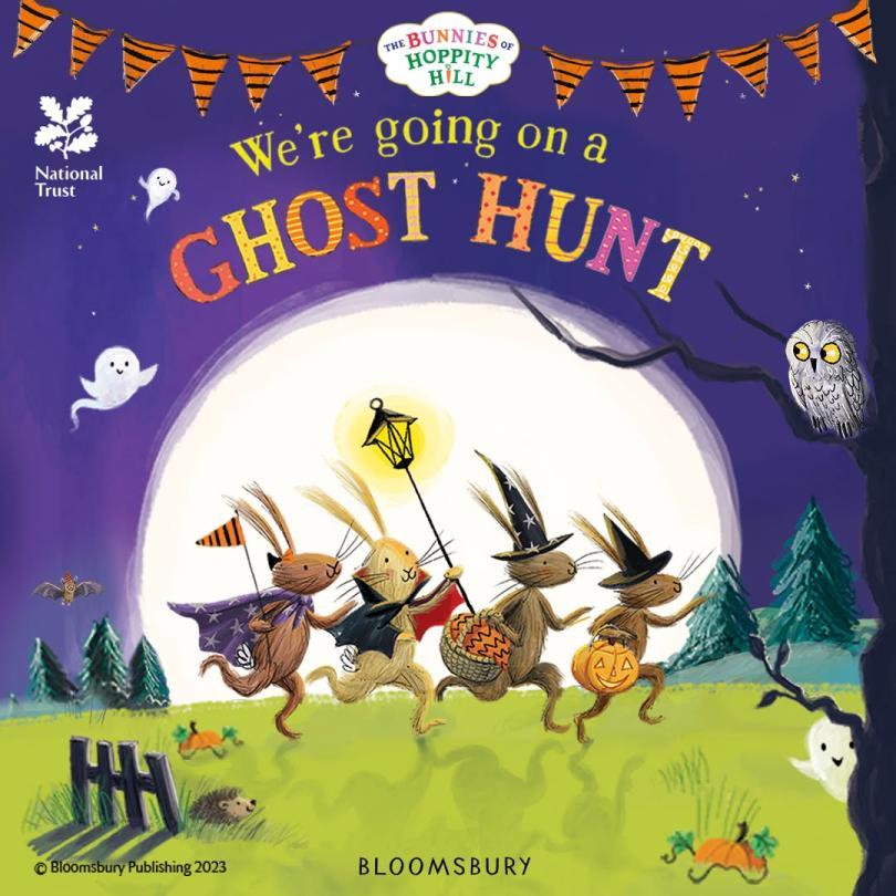 Illustrated book cover of "We’re Going on a Ghost Hunt" with animals in Halloween costumes walking in front of a giant moon