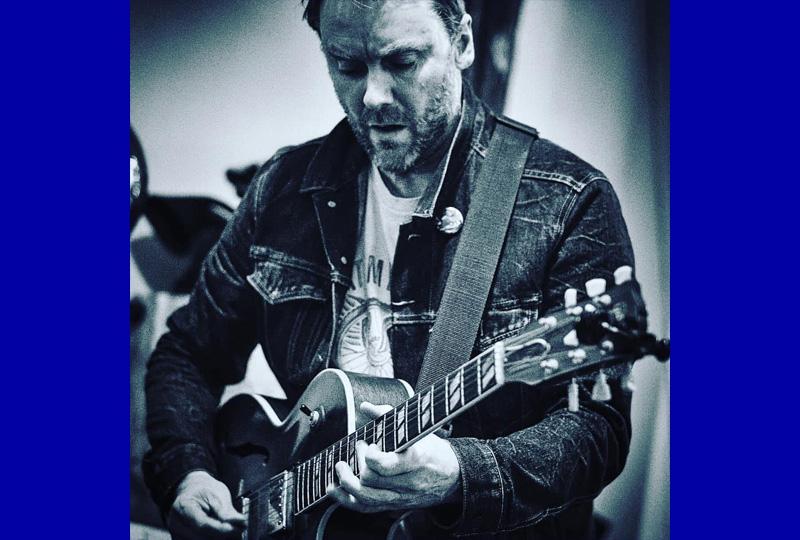 Hugh Turner playing guitar