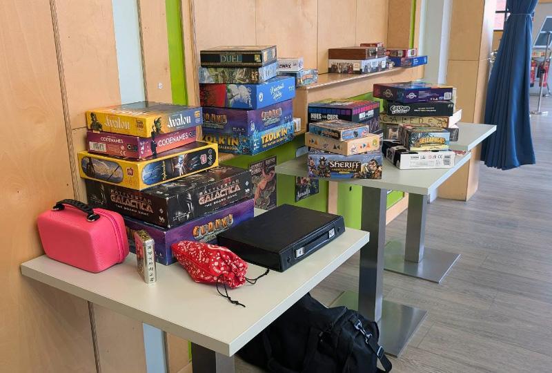 A stack of board games on a table