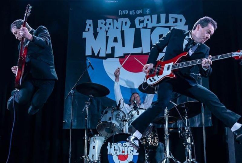 A Band Called Malice jumping on stage with Rickenbacker guitars